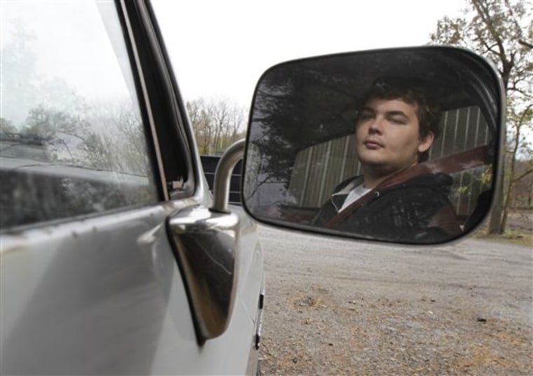 Cameron Dunn, 22, waits in his stepfather Ron Holladay's truck while Holladay goes to work in Battle Ground, Ind., on Wednesday. Dunn suffers epilepsy, autism, and attention deficit hyperactivity disorder. His mother Becky Holladay says that when she called Indiana's Bureau of Developmental Disabilities Services to ask about a Medicaid waiver to pay for services that support disabled people living independently, a bureau worker told her that leaving severely disabled people at homeless shelters is one option families have if they can't be cared for at home. 